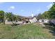 Large backyard with a covered patio, a shed, and a fire pit at 2537 Lanier Rd, Kissimmee, FL 34744