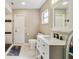 This bathroom features tiled floors, neutral paint, and a tub/shower combo at 2537 Lanier Rd, Kissimmee, FL 34744