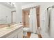 Cozy bathroom with a tub, shower, and sink at 2537 Lanier Rd, Kissimmee, FL 34744
