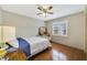 Bedroom with wood floors, a ceiling fan, and natural light at 2537 Lanier Rd, Kissimmee, FL 34744