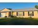 Charming single-story home featuring a well-maintained lawn and manicured landscaping at 2537 Lanier Rd, Kissimmee, FL 34744