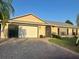 Charming single-story home featuring a brick-paved driveway and well-maintained landscaping at 2537 Lanier Rd, Kissimmee, FL 34744