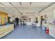 Spacious garage with ample storage space, tool racks, and a workbench at 2537 Lanier Rd, Kissimmee, FL 34744