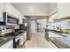 Functional kitchen featuring granite countertops, stainless steel appliances, and ample cabinet space at 2537 Lanier Rd, Kissimmee, FL 34744