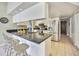 Stylish kitchen with granite countertops, stainless steel appliances, and a breakfast bar with seating at 2537 Lanier Rd, Kissimmee, FL 34744