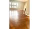 Bright living room featuring hardwood floors and a large window, creating a bright atmosphere at 2537 Lanier Rd, Kissimmee, FL 34744