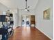 Spacious living area featuring hardwood floors, neutral paint, and an open layout to the dining area at 2537 Lanier Rd, Kissimmee, FL 34744