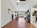 Open living space with hardwood floors, neutral walls, and seamless flow into the adjacent kitchen and dining areas at 2537 Lanier Rd, Kissimmee, FL 34744