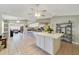 Bright open floor plan with living room, kitchen, and dining area is perfect for entertaining at 2537 Lanier Rd, Kissimmee, FL 34744