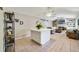 Bright open floor plan with living room, kitchen, and dining area is perfect for entertaining at 2537 Lanier Rd, Kissimmee, FL 34744