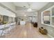 Open-concept living space boasts tiled flooring, neutral paint, and large windows allowing for natural light at 2537 Lanier Rd, Kissimmee, FL 34744