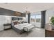Spacious bedroom with gray upholstered bed, dark accent wall, and chandelier at 2575 Winsome Way, Davenport, FL 33896