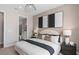 Comfortable bedroom with a king-size bed and an en-suite bathroom at 3393 Orange Rose Loop, Apopka, FL 32712