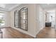 Light and airy entryway, hardwood floors, and mirrors reflecting the interior at 3393 Orange Rose Loop, Apopka, FL 32712
