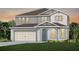 Two-story home with gray siding, a neutral-colored door, and a three-car garage at 3393 Orange Rose Loop, Apopka, FL 32712