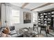 Home office with built-in shelving, a large desk, and comfortable seating at 3393 Orange Rose Loop, Apopka, FL 32712