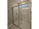 Large walk-in shower with marble tile and glass enclosure at 348 Birkdale Dr, Daytona Beach, FL 32124