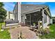 Backyard oasis with hot tub, patio, and screened porch at 377 River Chase Dr, Orlando, FL 32807