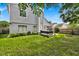 Spacious backyard with hot tub and grassy area at 377 River Chase Dr, Orlando, FL 32807