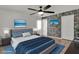 Bright bedroom with gray bedding and wood-look floors at 377 River Chase Dr, Orlando, FL 32807