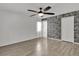 Spacious bedroom featuring wood-look floors and a modern accent wall at 377 River Chase Dr, Orlando, FL 32807