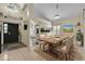 Bright dining area with a table for six and an open view of the kitchen at 377 River Chase Dr, Orlando, FL 32807