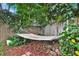 Relaxing hammock nestled in a secluded, lush garden area at 377 River Chase Dr, Orlando, FL 32807