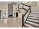 Spacious living room with high ceilings, a fireplace, and a staircase at 377 River Chase Dr, Orlando, FL 32807