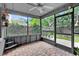 Spacious screened porch with brick flooring, providing a relaxing outdoor space at 377 River Chase Dr, Orlando, FL 32807