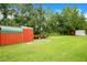 Large backyard with sheds and green space at 406 Malta Rd, Orlando, FL 32828