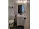 Bathroom with modern fixtures, a vanity with storage, stylish mirror, and modern toilet at 417 Benita St, Kissimmee, FL 34744