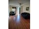 Spacious living room with hardwood floors, ceiling fan, ample natural light, and comfortable furniture at 417 Benita St, Kissimmee, FL 34744