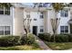 Inviting exterior of a two-story townhome with landscaping at 430 Southern Pecan Cir # 207, Winter Garden, FL 34787