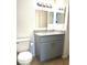 Bathroom with granite countertop and gray vanity at 4524 Commander Dr # 1613, Orlando, FL 32822
