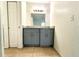 Bathroom with gray vanity and granite countertop at 4524 Commander Dr # 1613, Orlando, FL 32822