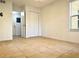 Bright bedroom with tile floors and a spacious closet at 4524 Commander Dr # 1613, Orlando, FL 32822