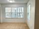 Bright dining area with large windows and view at 4524 Commander Dr # 1613, Orlando, FL 32822