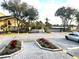 Community entrance with gated access and landscaping at 4524 Commander Dr # 1613, Orlando, FL 32822