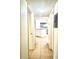 Hallway view of a kitchen with light blue cabinets at 4524 Commander Dr # 1613, Orlando, FL 32822