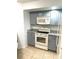 Modern kitchen with gray cabinets and granite countertops at 4524 Commander Dr # 1613, Orlando, FL 32822