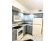 Modern kitchen with gray cabinets and granite counters at 4524 Commander Dr # 1613, Orlando, FL 32822
