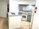 Modern kitchen with gray cabinets and granite countertops at 4524 Commander Dr # 1613, Orlando, FL 32822