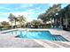 Refreshing community pool with lounge chairs at 4524 Commander Dr # 1613, Orlando, FL 32822