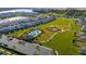 Aerial view of community amenities including pool, playground, and residential homes at 494 Amadoras Way, St Cloud, FL 34771