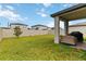 Spacious backyard with patio area, privacy fence, and lush green grass offering a perfect outdoor retreat at 494 Amadoras Way, St Cloud, FL 34771