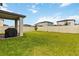 This expansive backyard showcases a lush lawn, complete with a patio area and barbecue, perfect for Gathering gatherings at 494 Amadoras Way, St Cloud, FL 34771