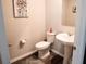 Powder room with pedestal sink and wood-look tile floor at 494 Amadoras Way, St Cloud, FL 34771