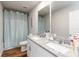 Bathroom featuring double vanity, a shower, and an enclosed toilet, providing convenience and privacy at 494 Amadoras Way, St Cloud, FL 34771