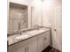 Bathroom with double vanity, granite countertop, and walk-in shower at 494 Amadoras Way, St Cloud, FL 34771