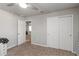 Cozy bedroom with carpeting, ceiling fan, closet, and convenient access to the ensuite bathroom at 494 Amadoras Way, St Cloud, FL 34771